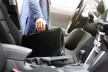 Businessman Taking Briefcase Our Of Car